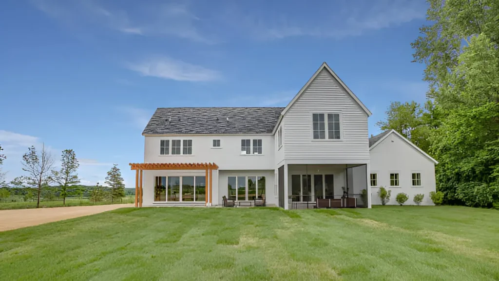 A photo of a ranch-style home in Colorado with a low-pitched roof, a large patio, and a functional design that complements the sprawling landscape
