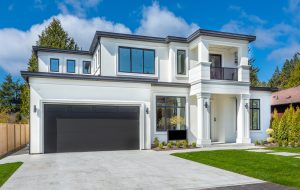 Beautiful contemporary white house with lush grass and blue sky twilight and daylight