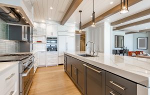 Luxurious high end kitchen with stainless appliances marble and glass tile