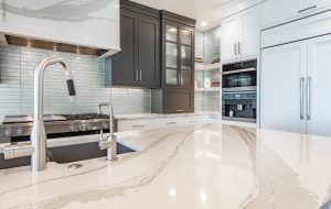 Luxurious high end kitchen with stainless appliances marble and glass tile